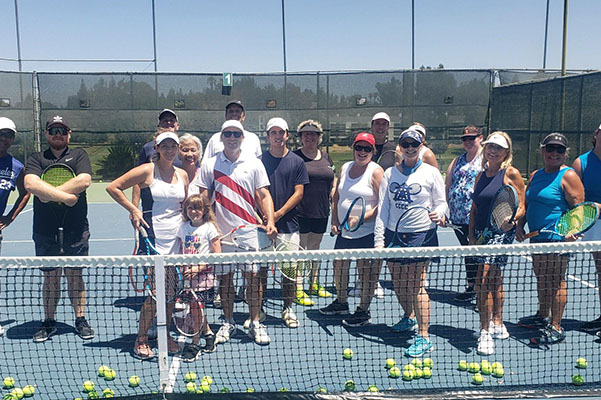 Tennis players on course during the day