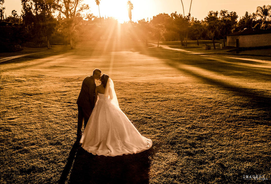 bride and groom on golf course