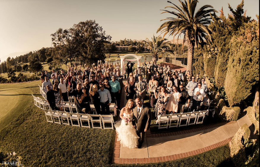 wedding guests with newlyweds