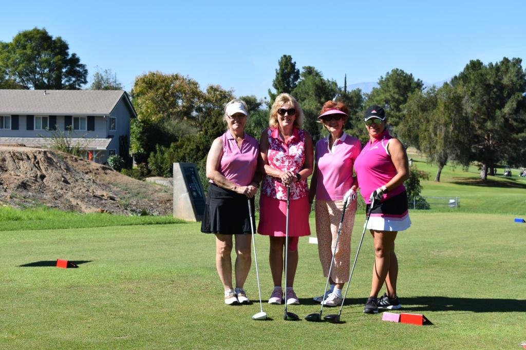 tournament participants in pink shirts