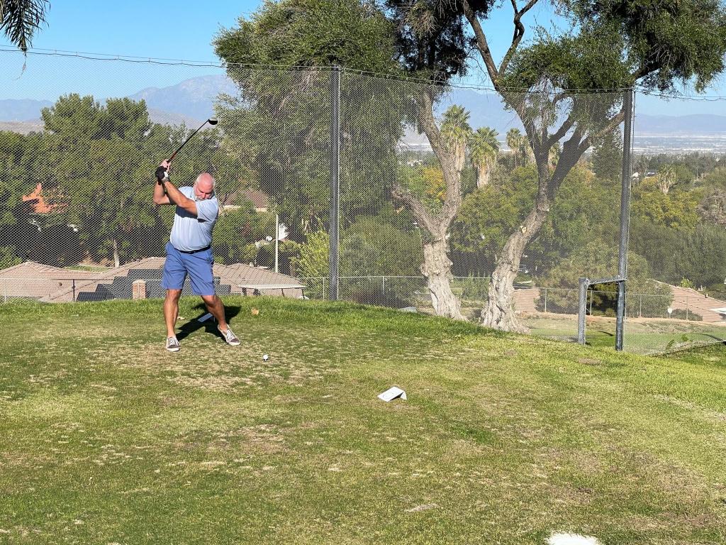golfer on course taking a swing